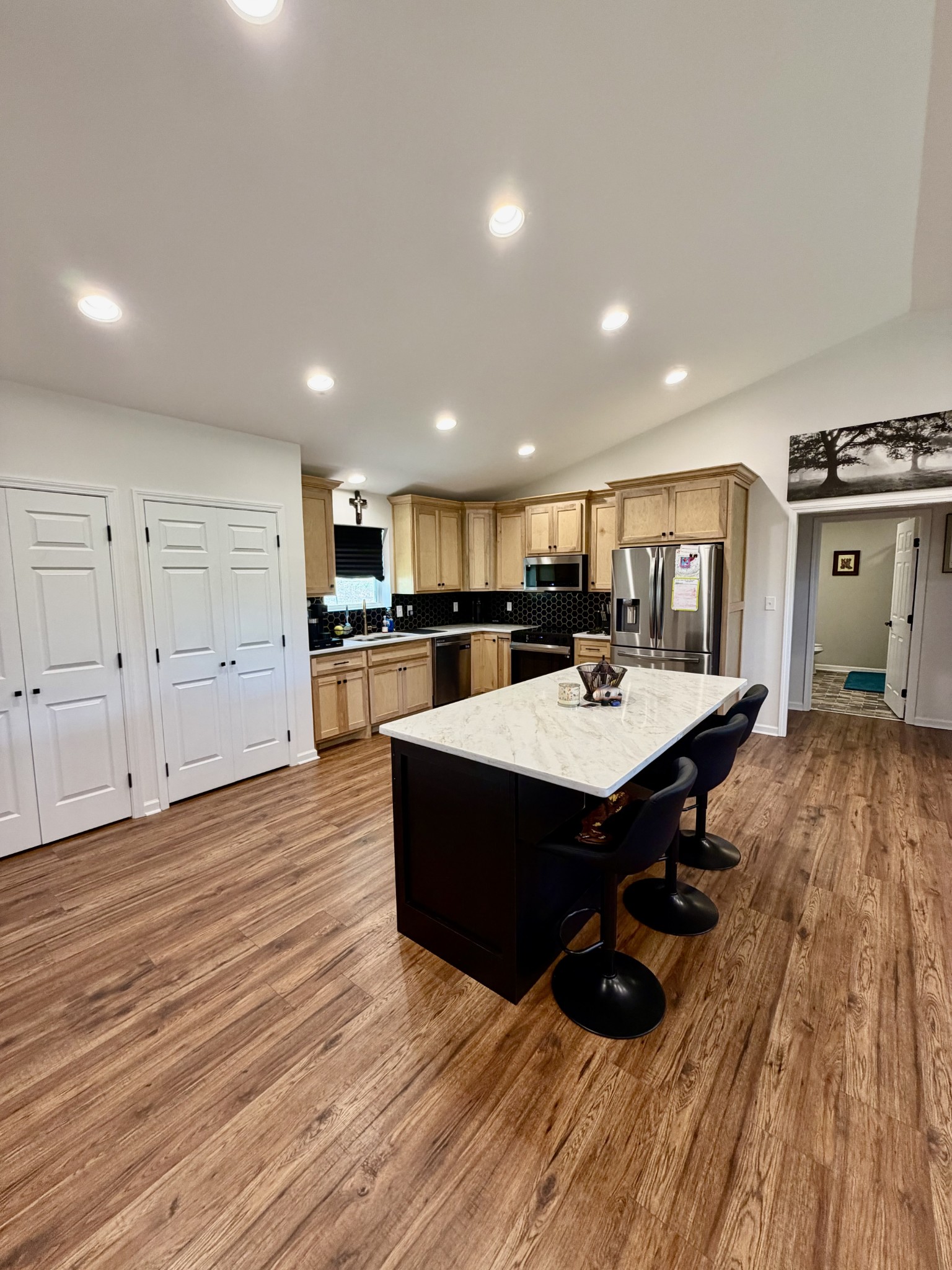 3 Harrison Road Five Points, TN 38457 - Photo 12 of 34 a living room with stainless steel appliances furniture wooden floor and a kitchen view