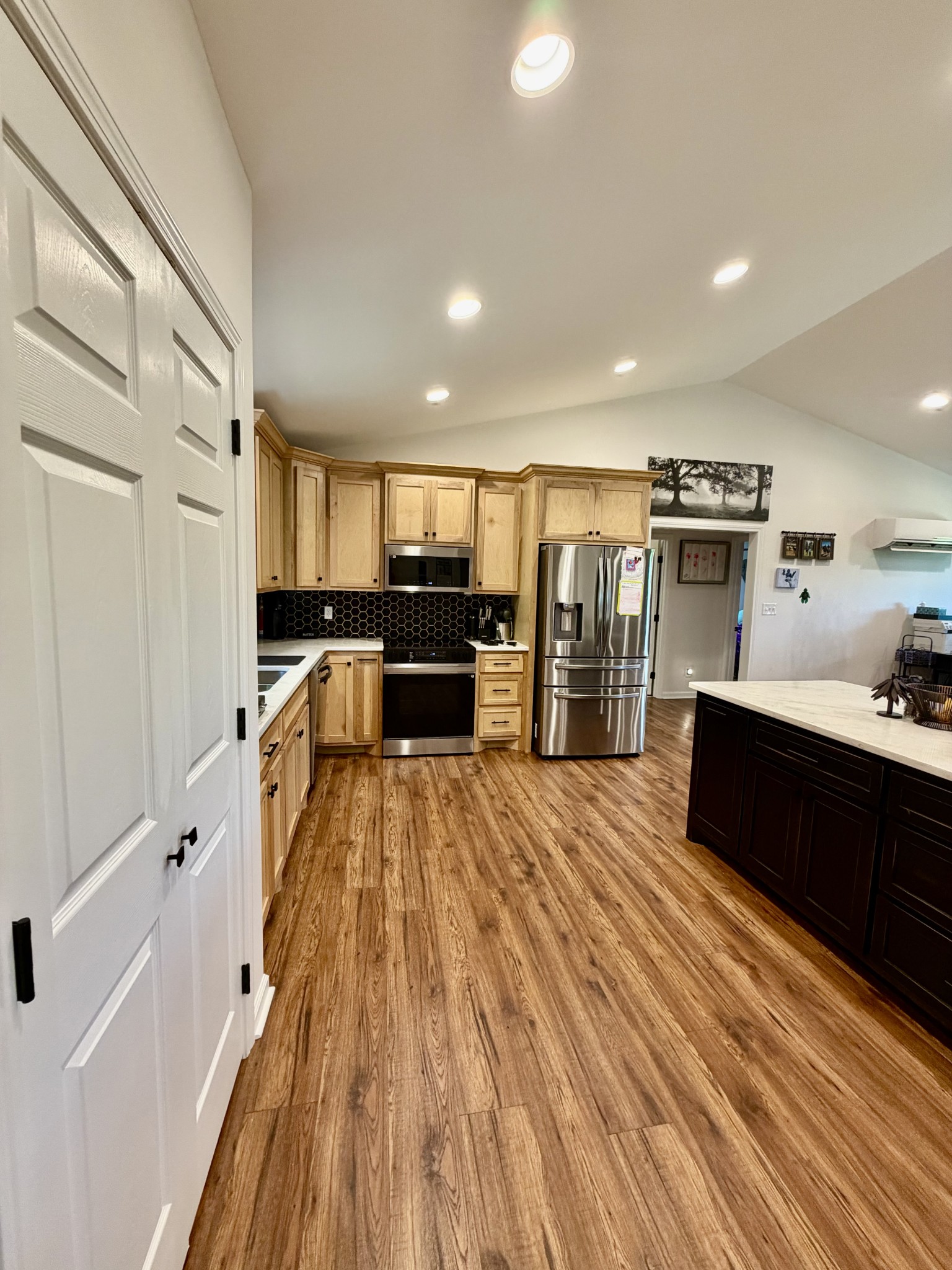 3 Harrison Road Five Points, TN 38457 - Photo 14 of 34 a large kitchen with stainless steel appliances a large counter top a stove and a refrigerator