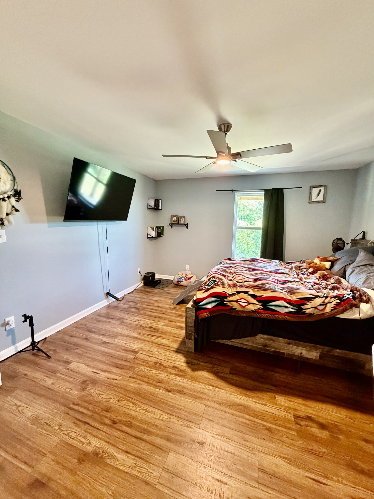 3 Harrison Road Five Points, TN 38457 - Photo 16 of 34 a bedroom with a large bed and a flat screen tv