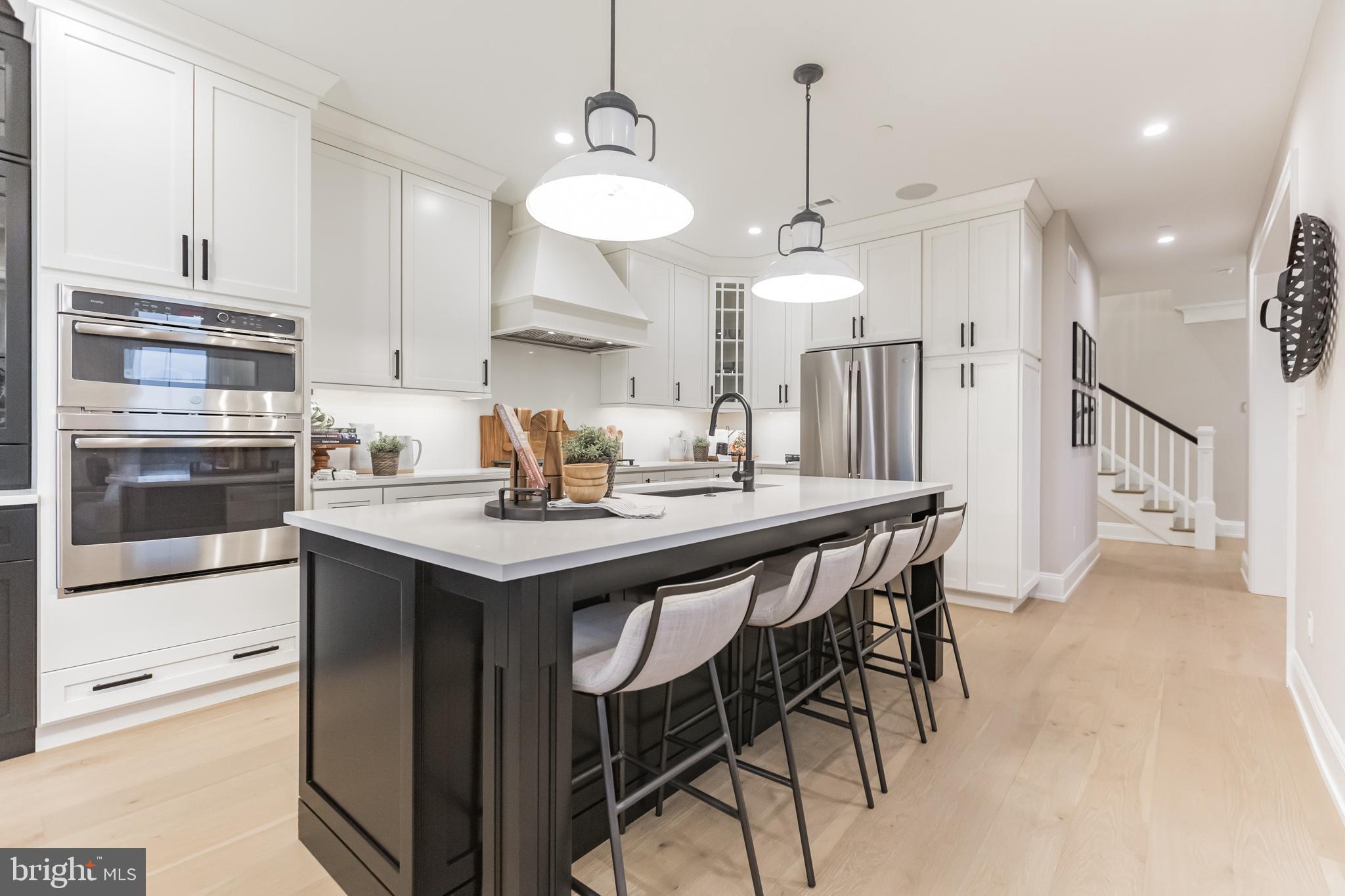 715 Hampton Road, Unit 103 Ambler, PA 19002 - Photo 11 of 27 a kitchen with a table and chairs in it