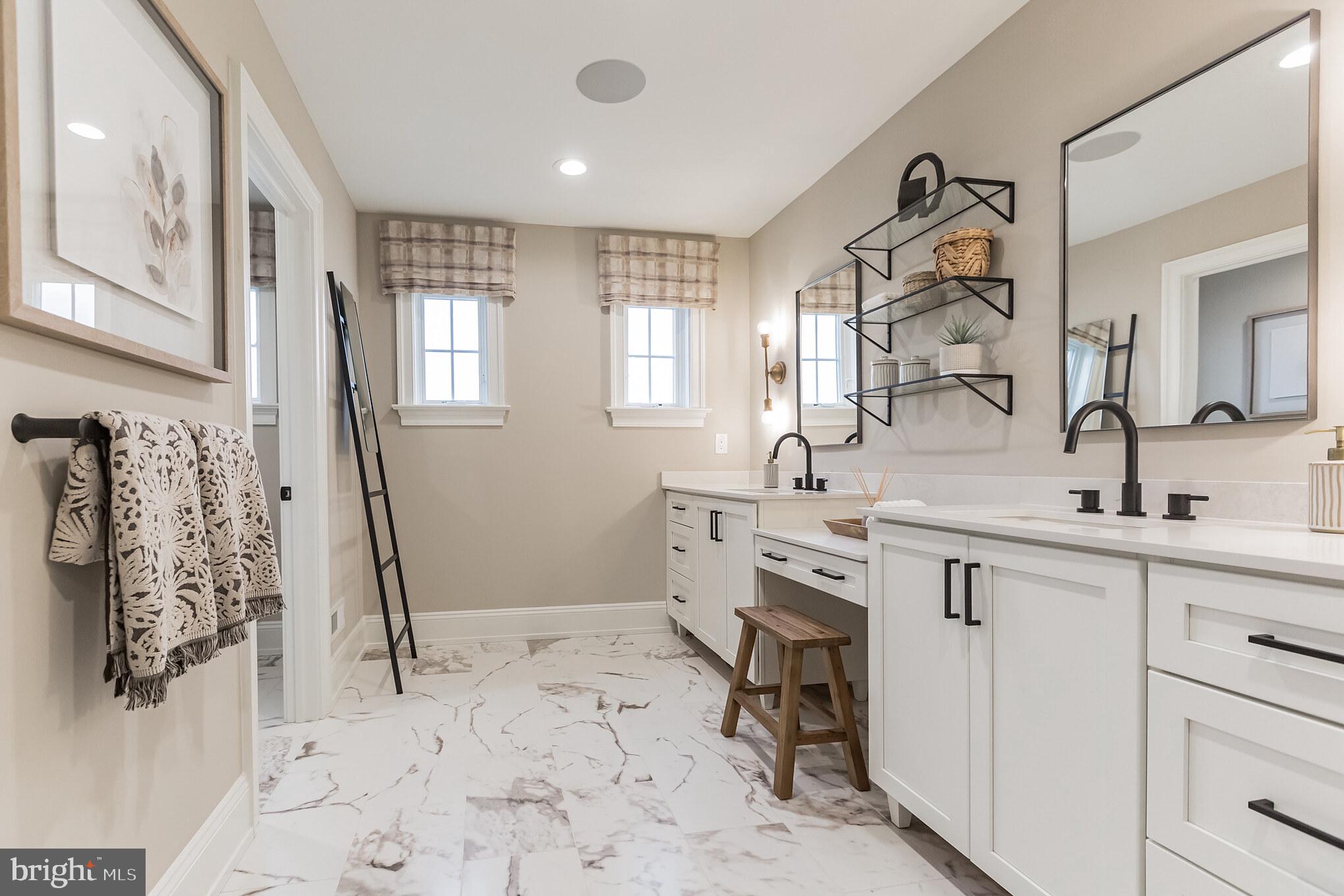 715 Hampton Road, Unit 103 Ambler, PA 19002 - Photo 25 of 27 a spacious bathroom with a sink and a mirror