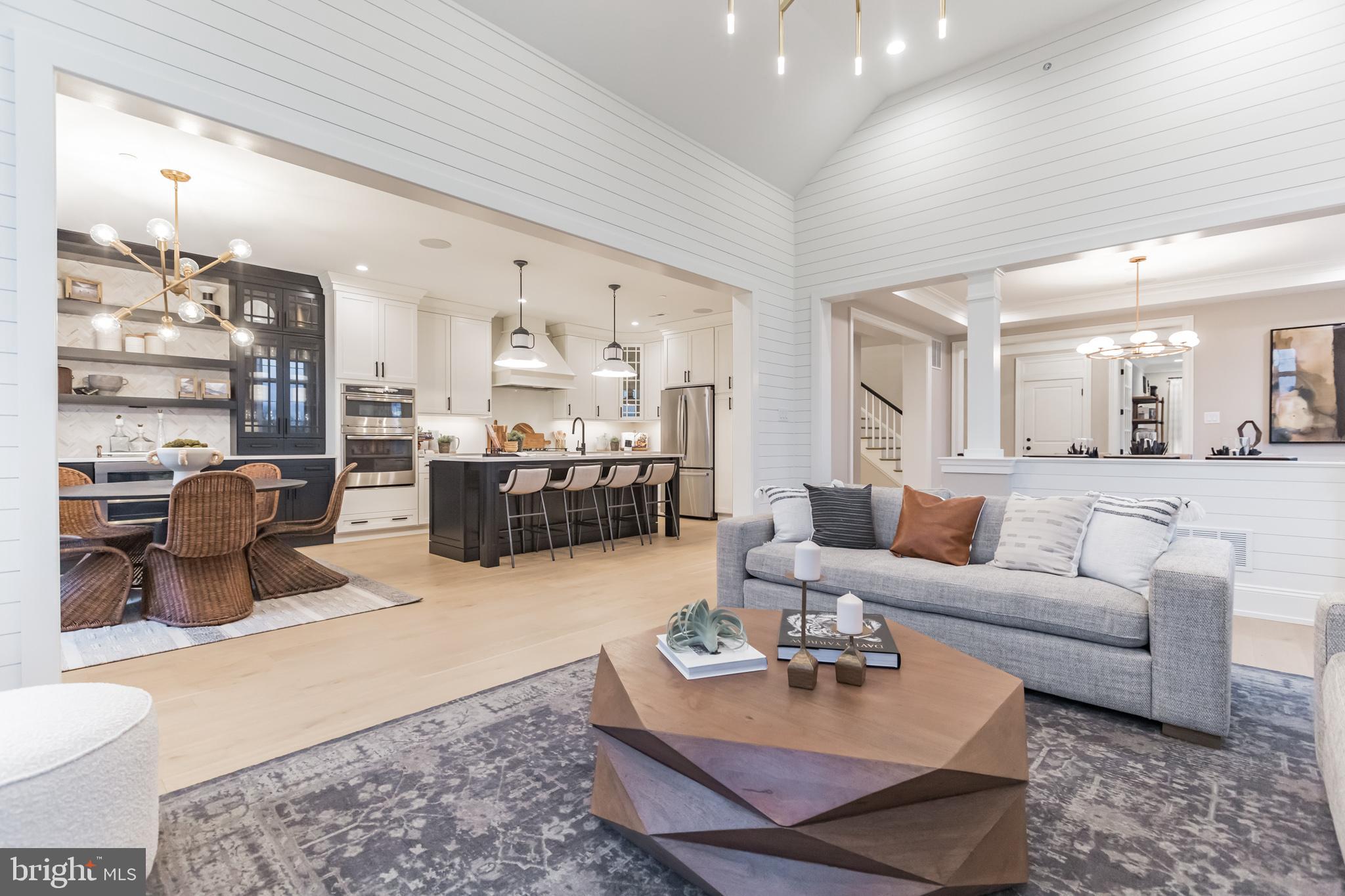 715 Hampton Road, Unit 103 Ambler, PA 19002 - Photo 5 of 27 a living room with furniture and a kitchen view