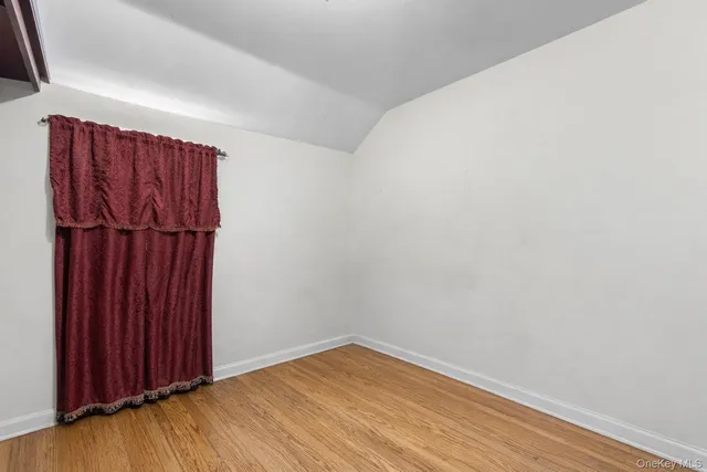 a view of a room with wooden walls