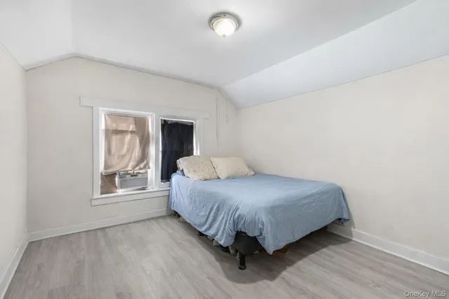 a room with a bed and a window