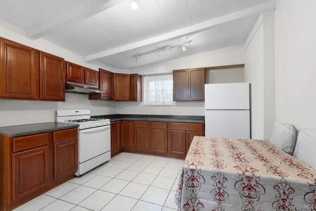 a kitchen with stainless steel appliances granite countertop a sink and cabinets