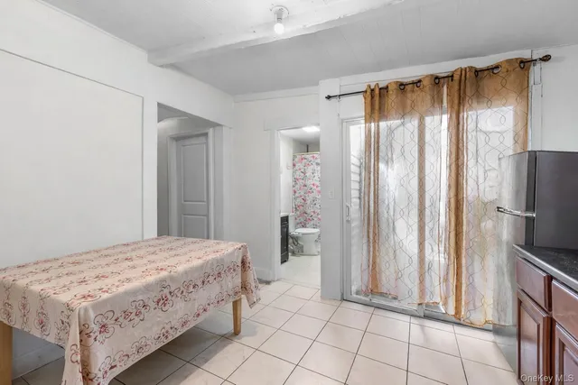 a bedroom with a bed and a mirror