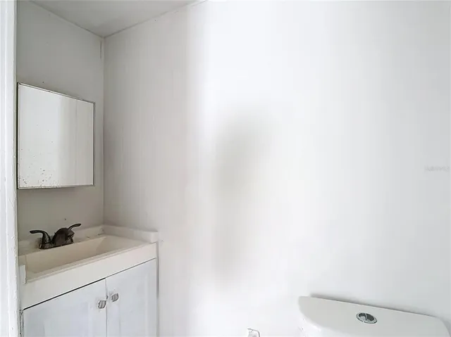 a bathroom with a sink and cabinets