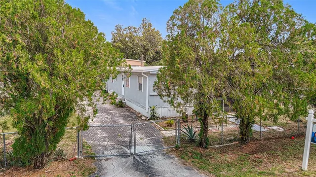 a house view with a backyard space