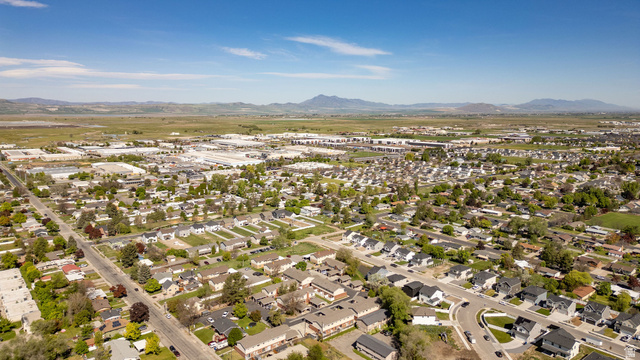 283 West 600 North, Unit 2 Logan, UT 84321 - Photo 24 of 36 Expansive aerial view of a residential area featuring numerous single-family homes and multi-unit residences