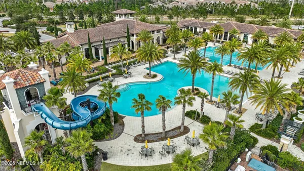 a view of swimming pool with outdoor seating