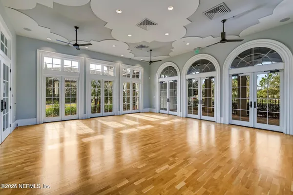 a view of an entryway with wooden floor