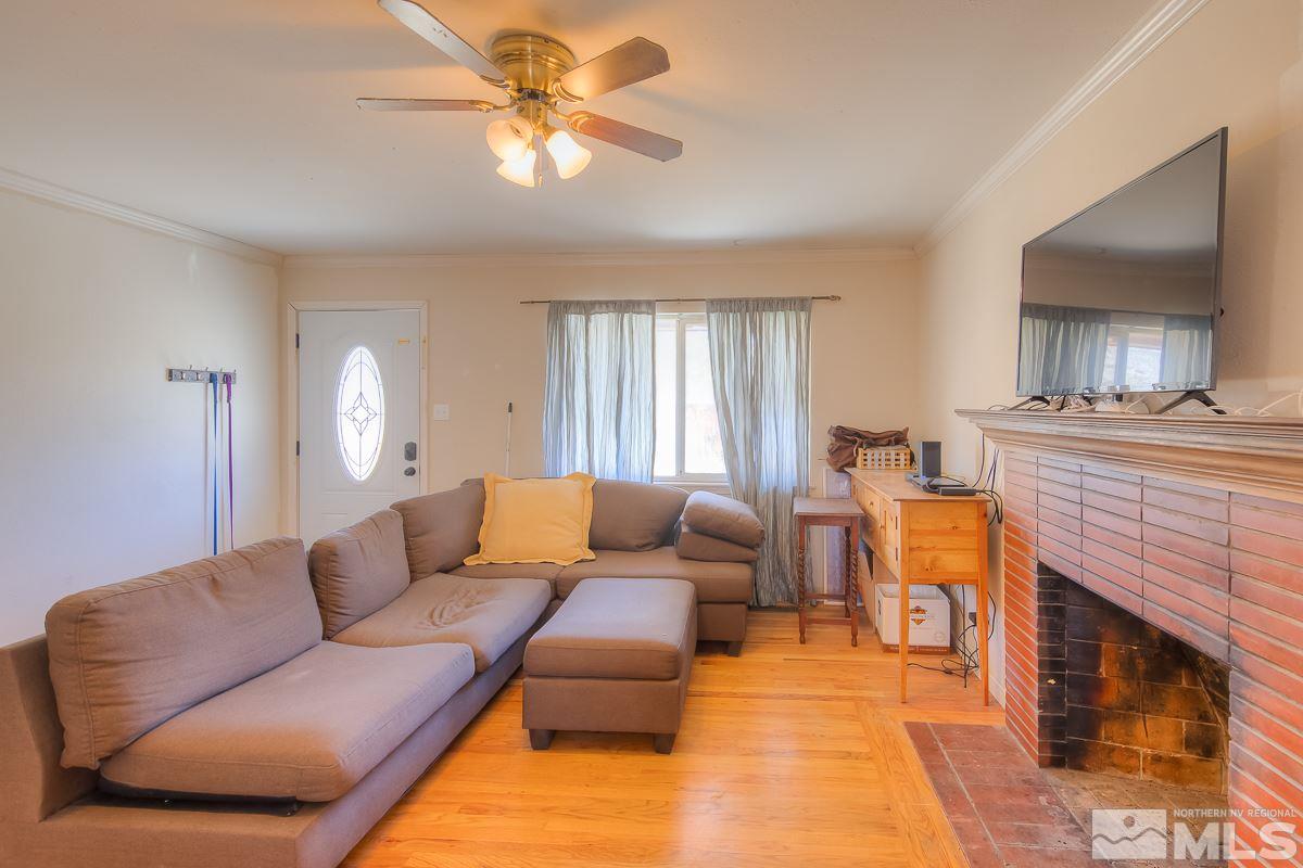 895 Cherry Lane Reno, NV 89509 - Photo 4 of 26 a living room with furniture and a fireplace