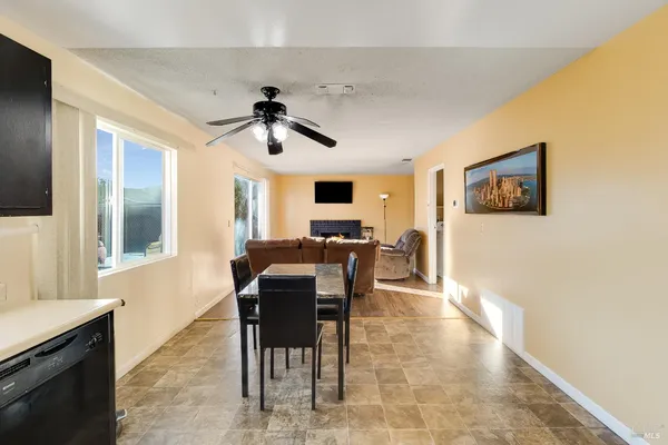 a view of a livingroom with furniture and a window