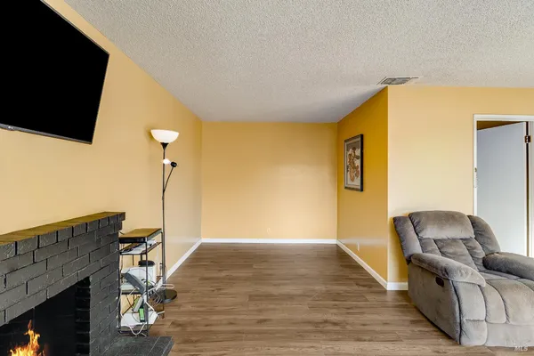 a view of a livingroom with furniture and staircase