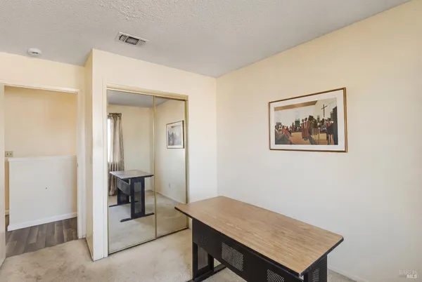 a view of a workspace with furniture