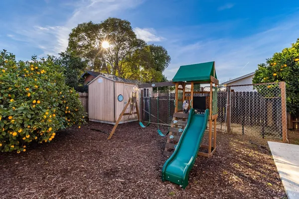 a view of a backyard with a slide