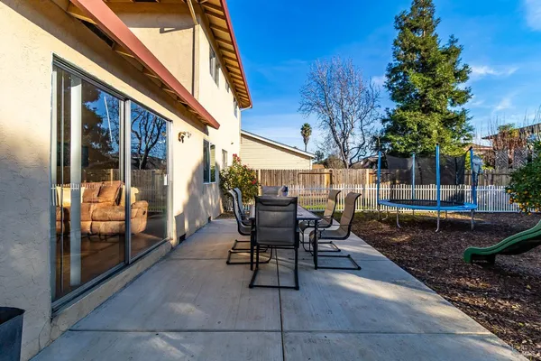 a view of a chairs and tables in the patio