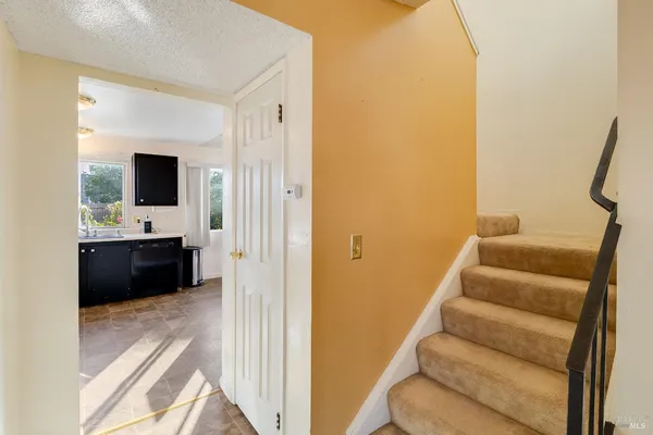 a view of a bathroom with sink and mirror