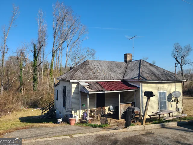 a front view of a house with a porch