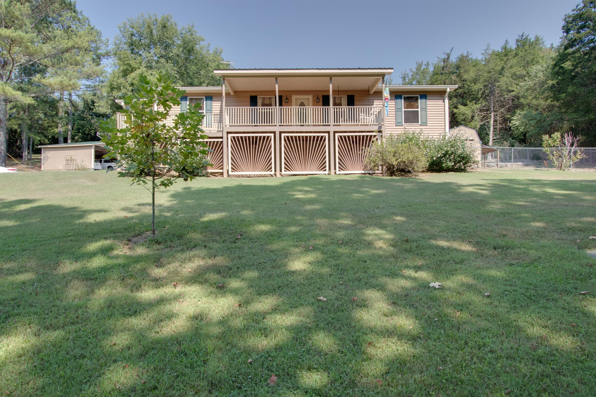 a house with a tree in front of it