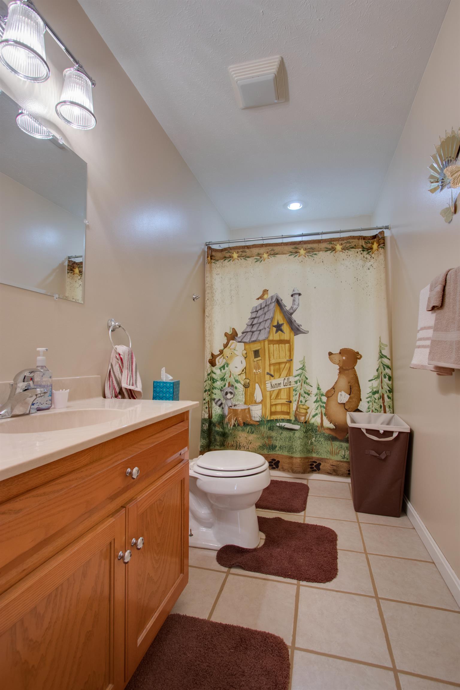 200 East Buffalo Road Carthage, TN 37030 - Photo 12 of 30 a bathroom with a toilet sink and mirror