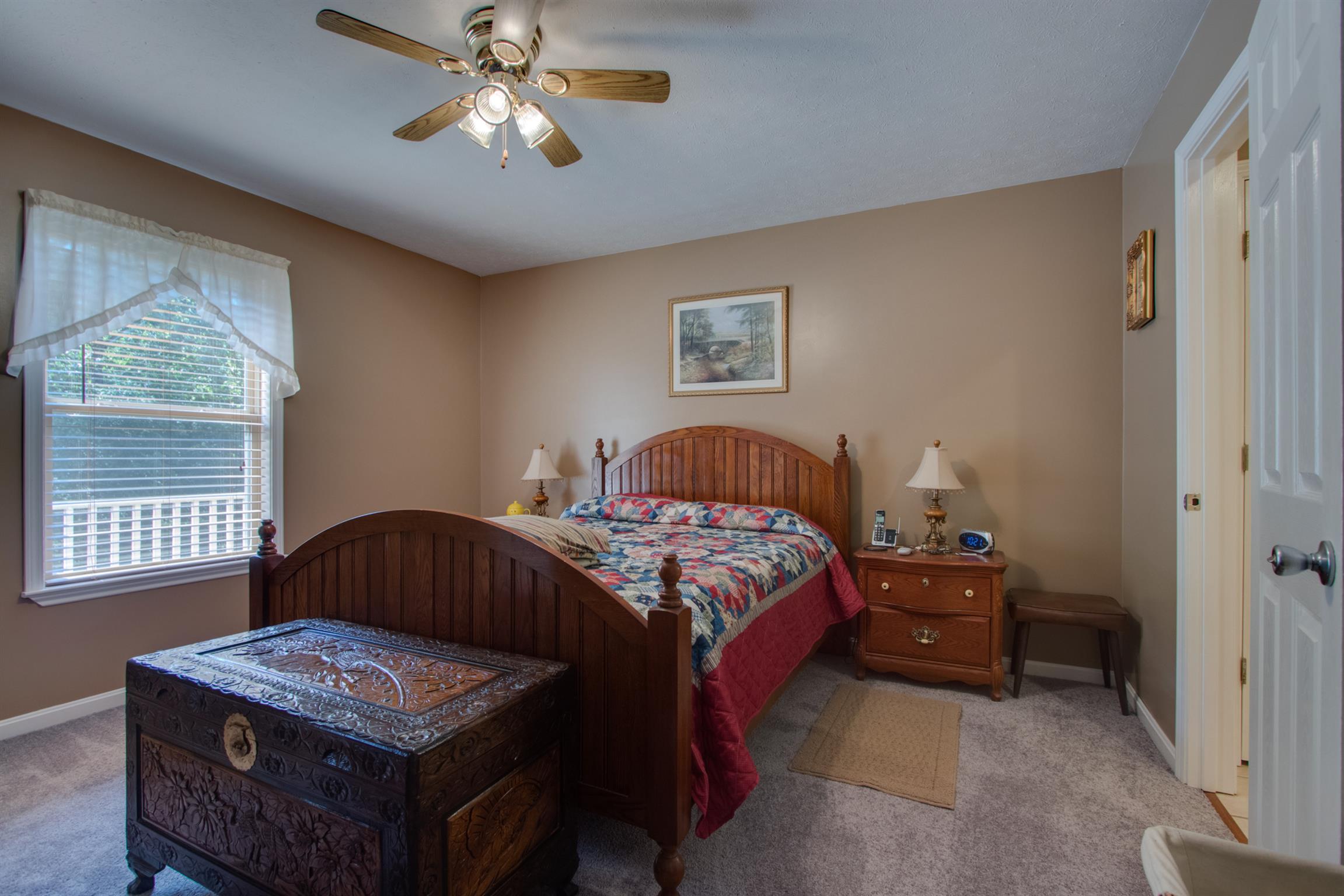 200 East Buffalo Road Carthage, TN 37030 - Photo 13 of 30 a bedroom with a bed and a dresser next to a window