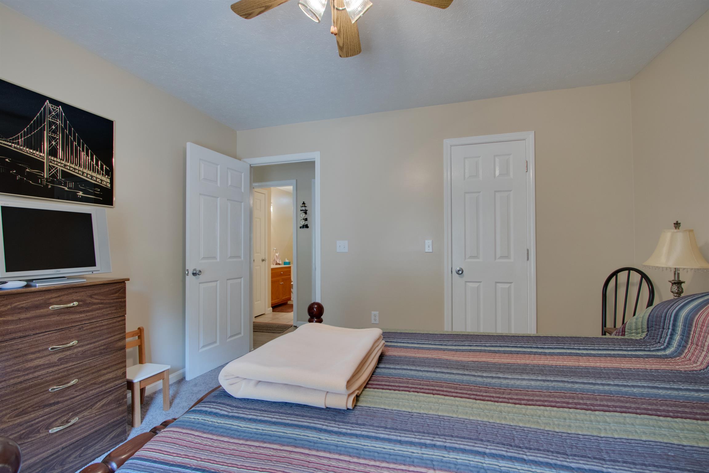 200 East Buffalo Road Carthage, TN 37030 - Photo 17 of 30 a bedroom with furniture and flat screen tv