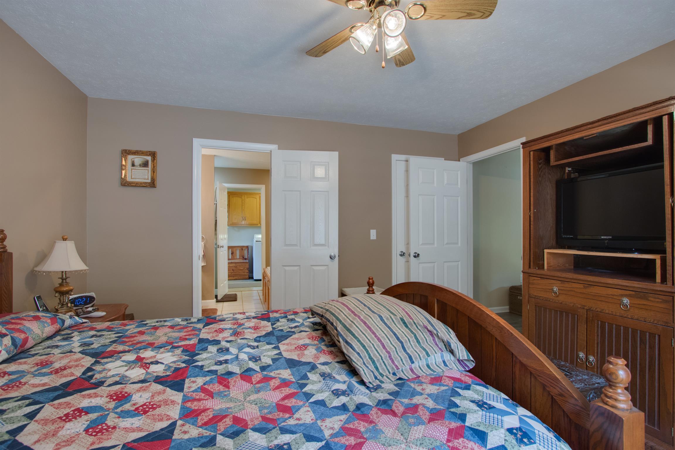 200 East Buffalo Road Carthage, TN 37030 - Photo 19 of 30 a bedroom with a bed and a flat screen tv