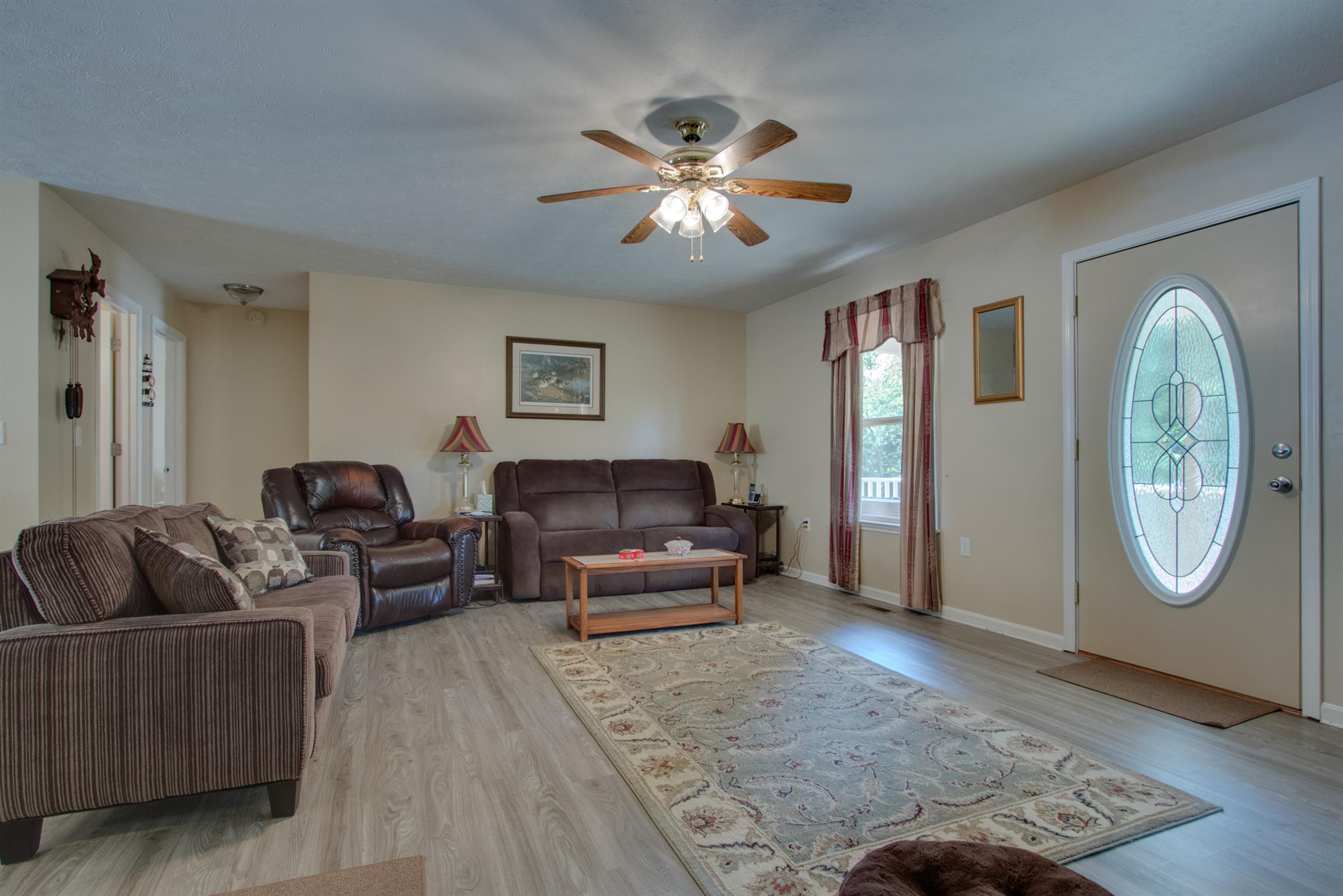 200 East Buffalo Road Carthage, TN 37030 - Photo 3 of 30 a living room with furniture a clock and a rug