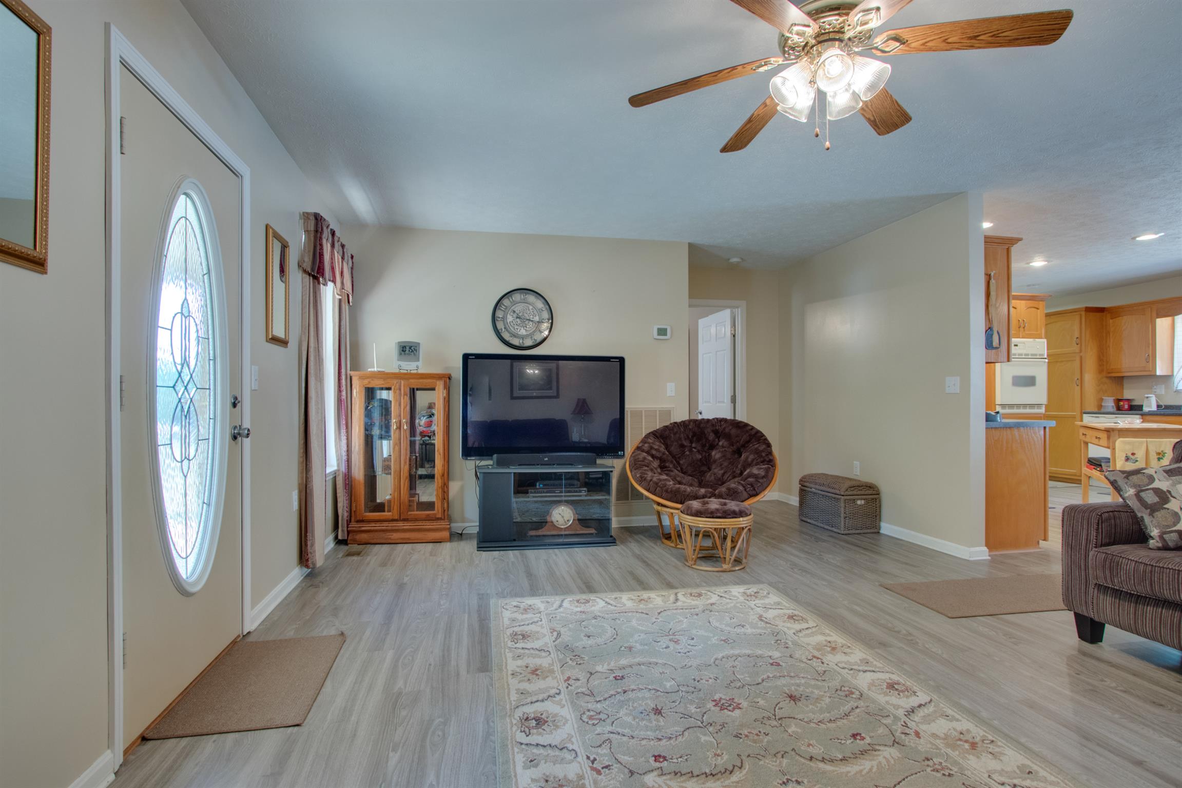 200 East Buffalo Road Carthage, TN 37030 - Photo 4 of 30 a living room with furniture a flat screen tv and kitchen view