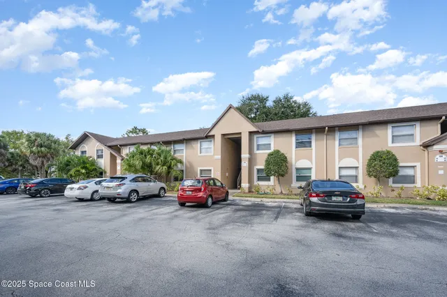 a car parked in front of white house