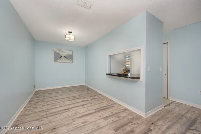 a view of a livingroom with wooden floor
