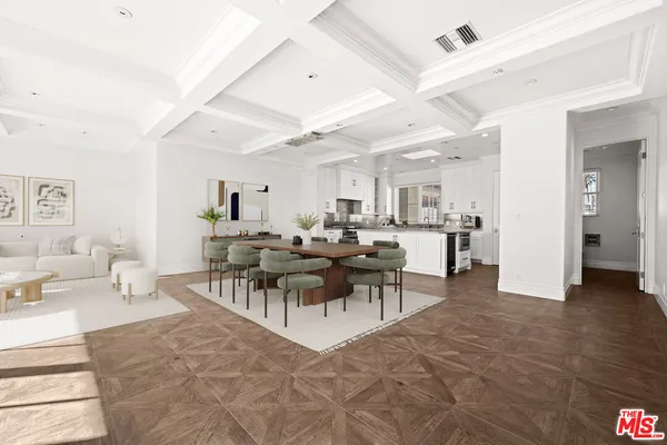 a large white kitchen with a sink