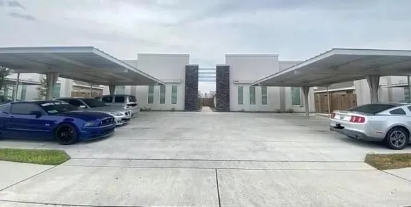 a view of parking space with garage