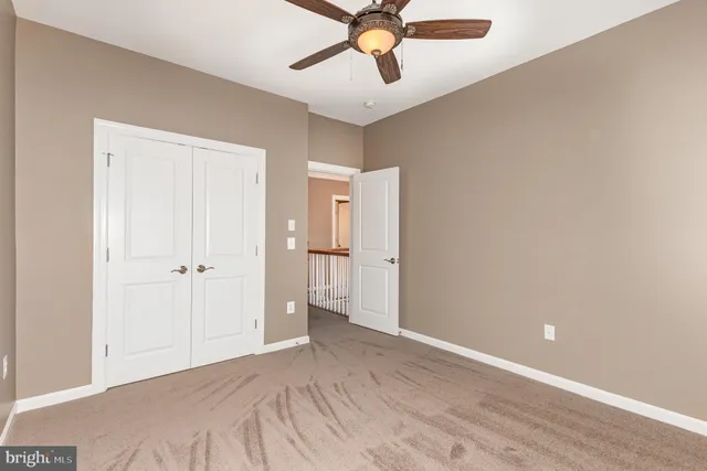 a view of a livingroom with a ceiling fan