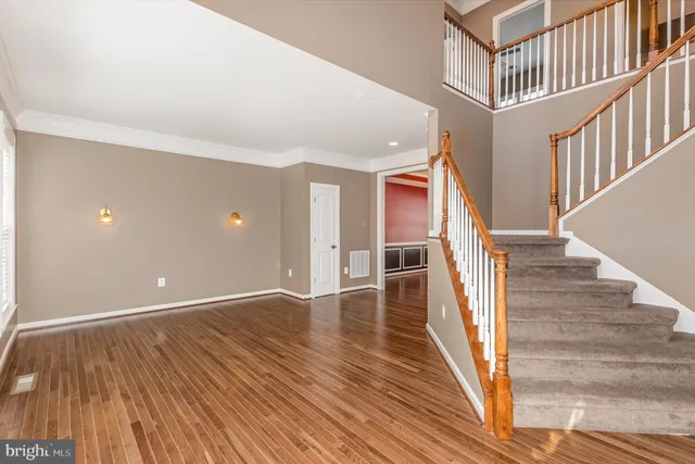 a view of an entryway with wooden floor