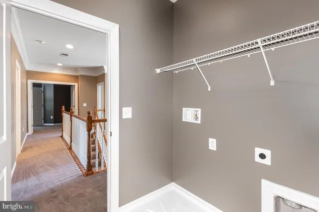 a view of a hallway with a white walls