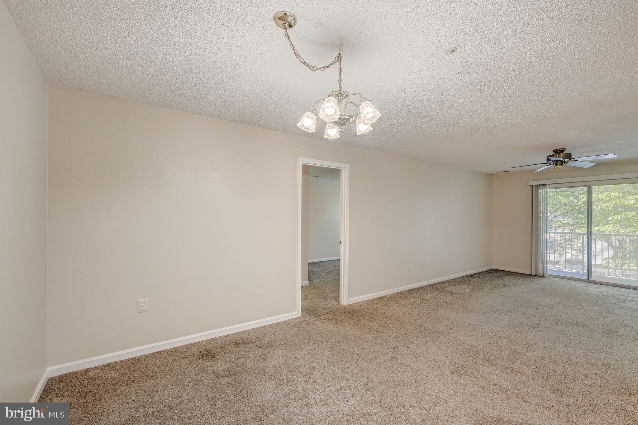 12903 Churchill Ridge Circle, Unit 6 Germantown, MD 20874 - Photo 11 of 36 a view of an empty room with a window