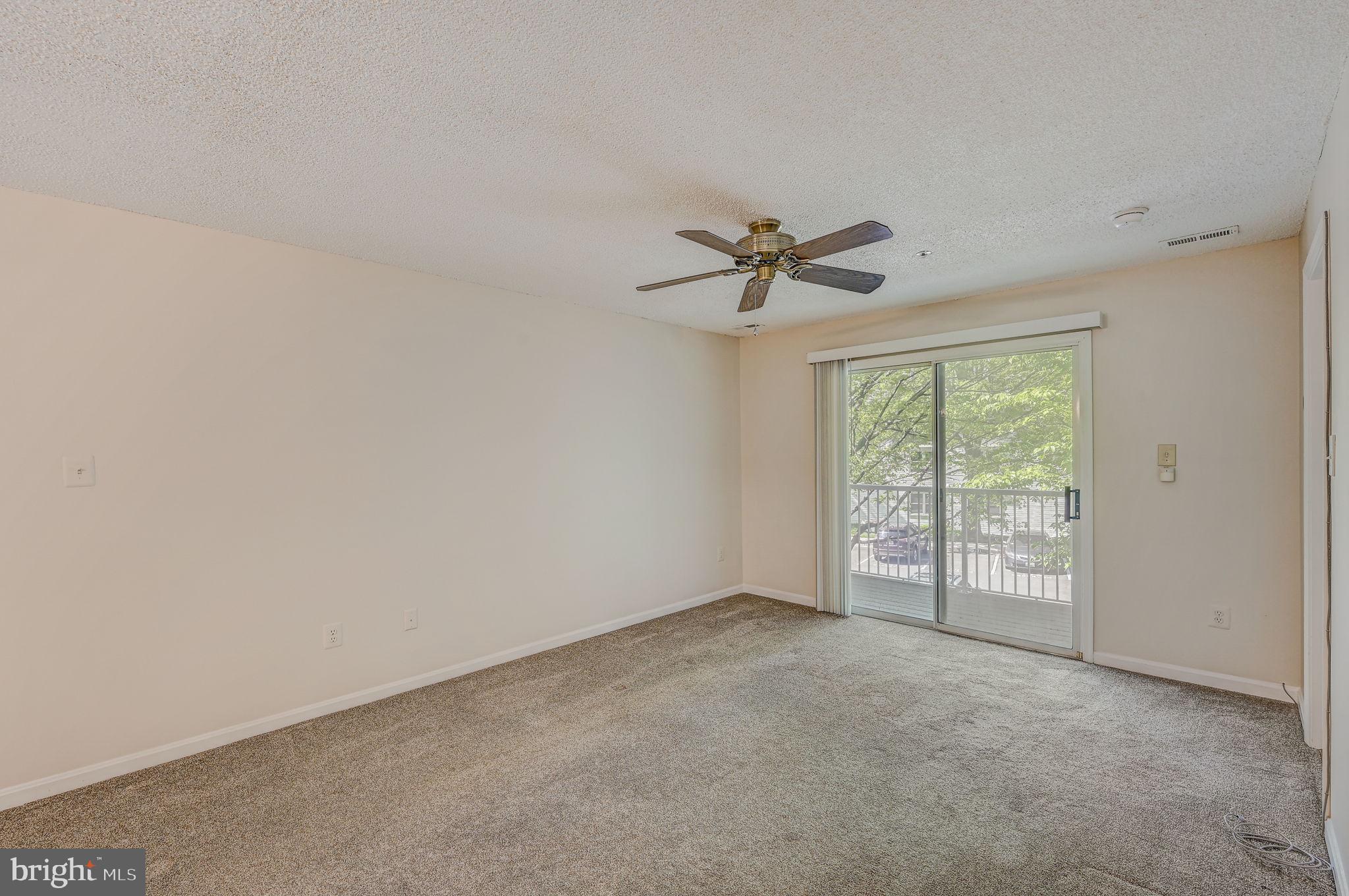 12903 Churchill Ridge Circle, Unit 6 Germantown, MD 20874 - Photo 12 of 36 a view of an empty room with a window