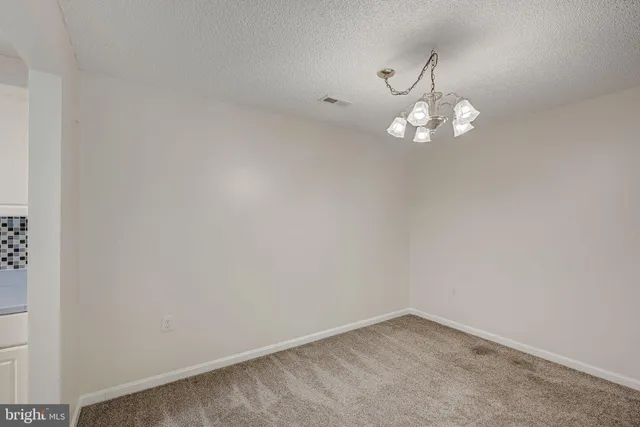 a view of a chandelier in big room