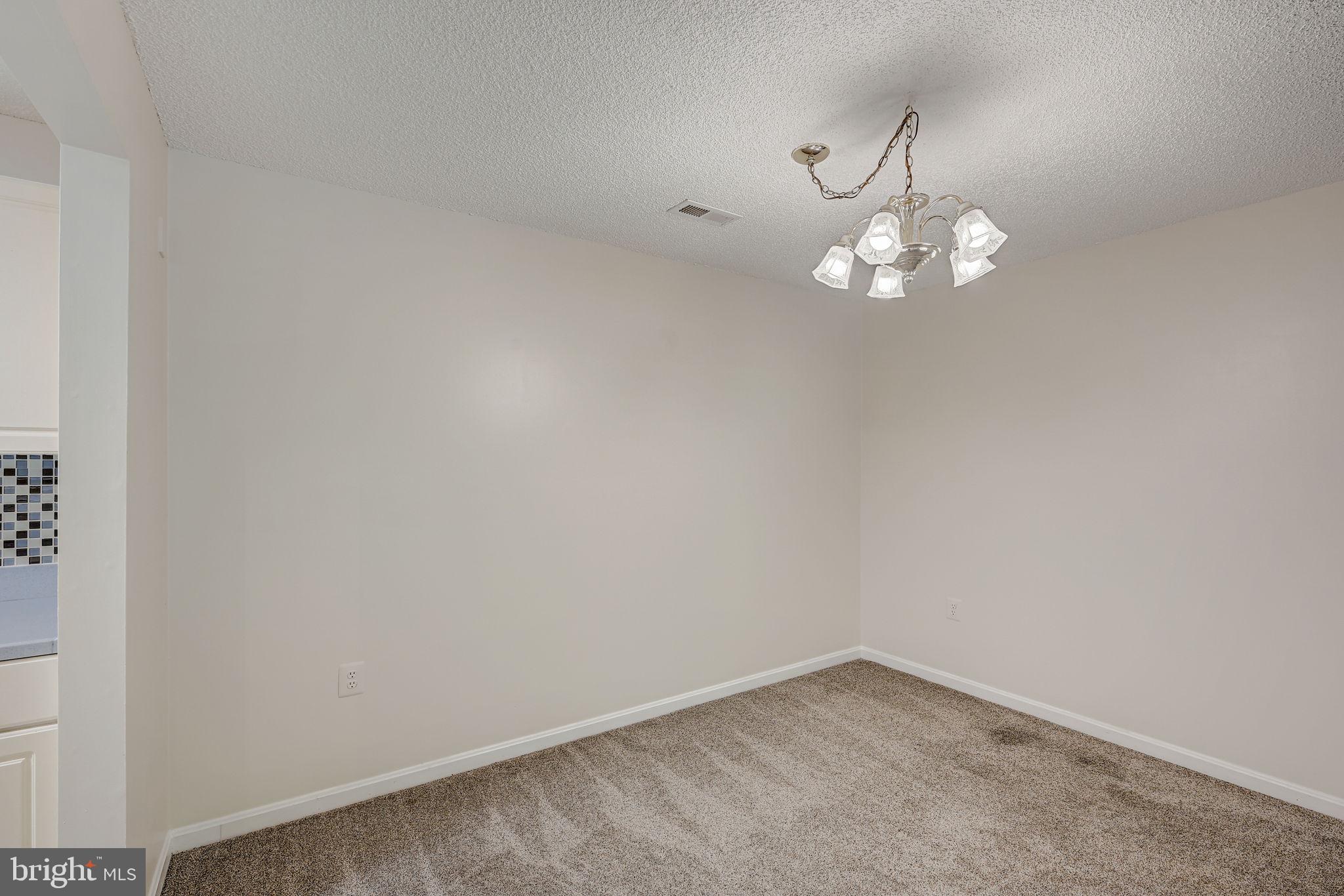 12903 Churchill Ridge Circle, Unit 6 Germantown, MD 20874 - Photo 13 of 36 a view of a chandelier in big room