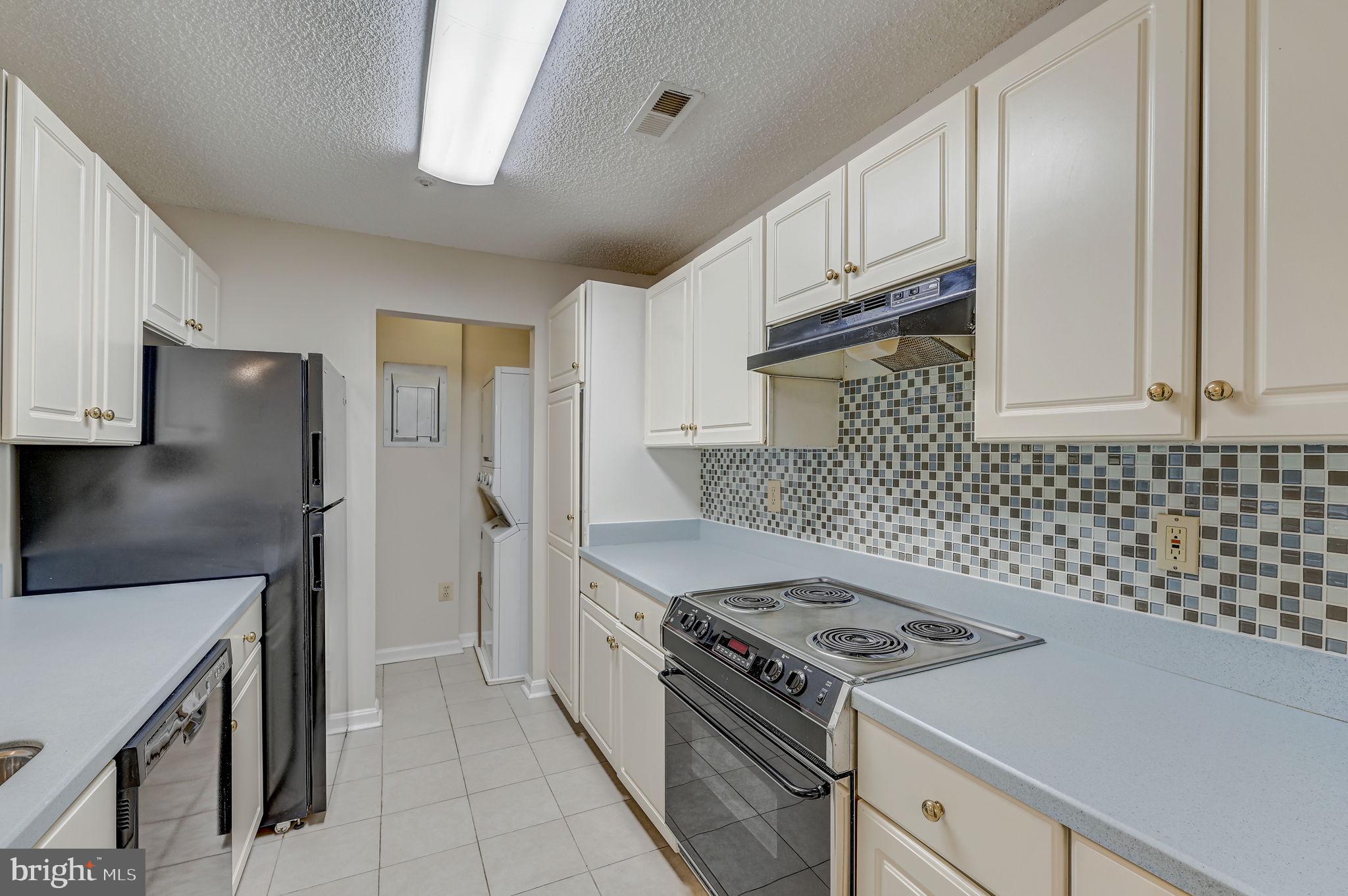 12903 Churchill Ridge Circle, Unit 6 Germantown, MD 20874 - Photo 14 of 36 a kitchen with cabinets and steel stainless steel appliances