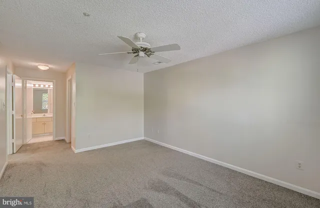 a view of a big room with carpet