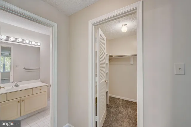 a bathroom with a double vanity sink and mirror