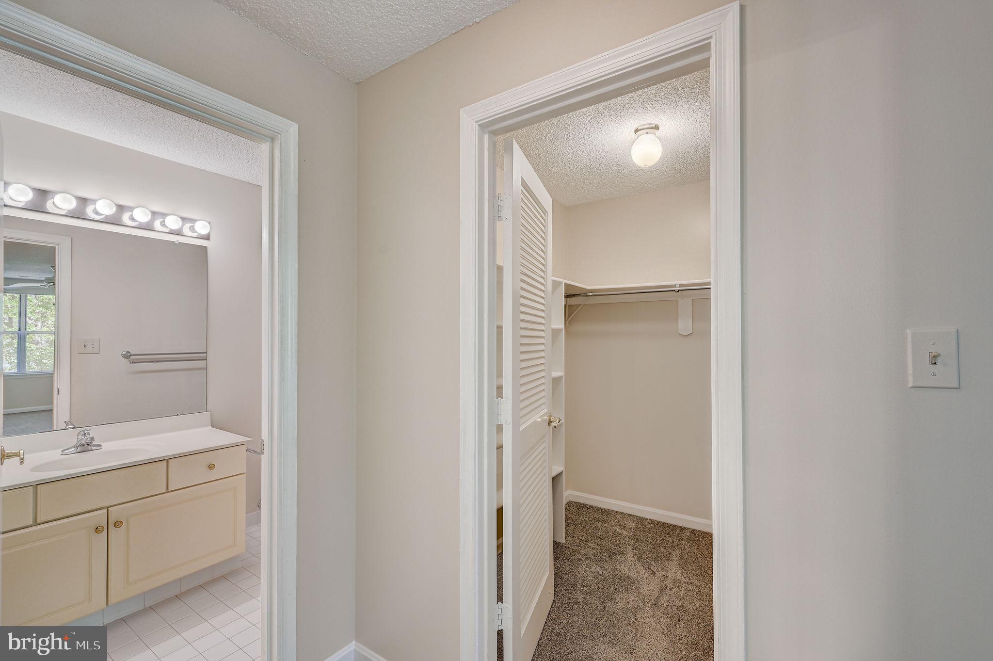 12903 Churchill Ridge Circle, Unit 6 Germantown, MD 20874 - Photo 33 of 36 a bathroom with a double vanity sink and mirror