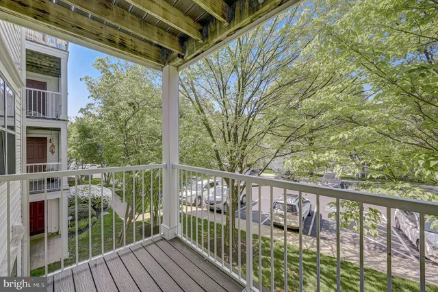 a view of a balcony with wooden floor