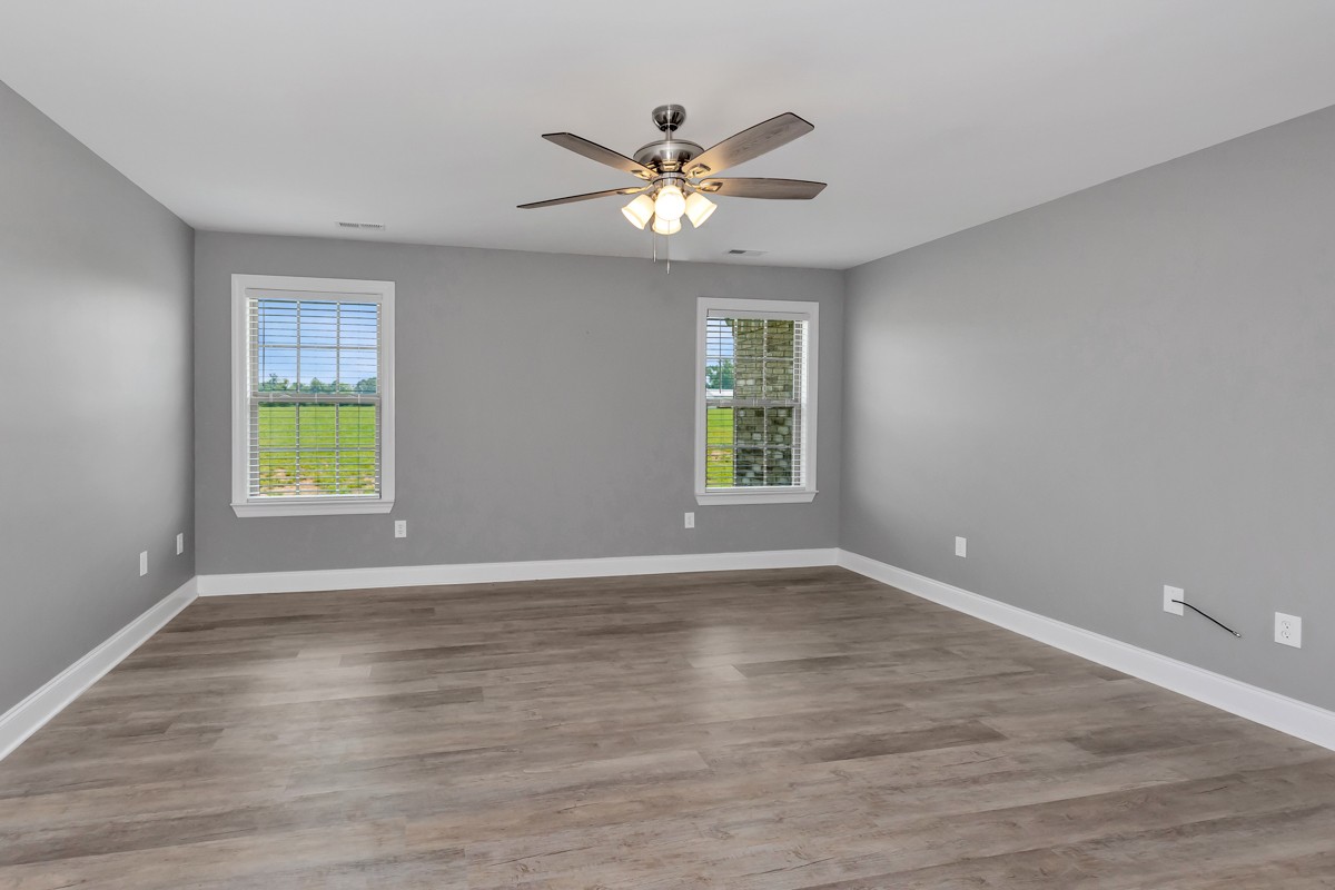 28600 Reyer Road Ardmore, AL 35739 - Photo 11 of 28 a view of an empty room with wooden floor and a window