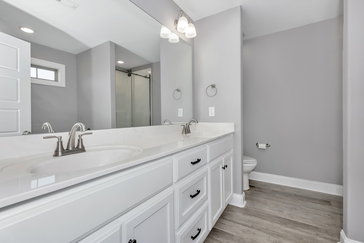 28600 Reyer Road Ardmore, AL 35739 - Photo 13 of 28 a bathroom with a double vanity sink mirror and toilet
