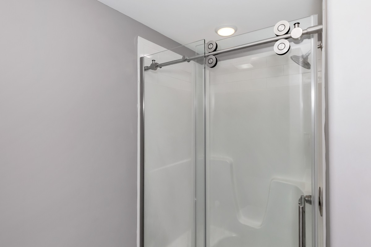 28600 Reyer Road Ardmore, AL 35739 - Photo 15 of 28 a bathroom with a glass shower door and a shower