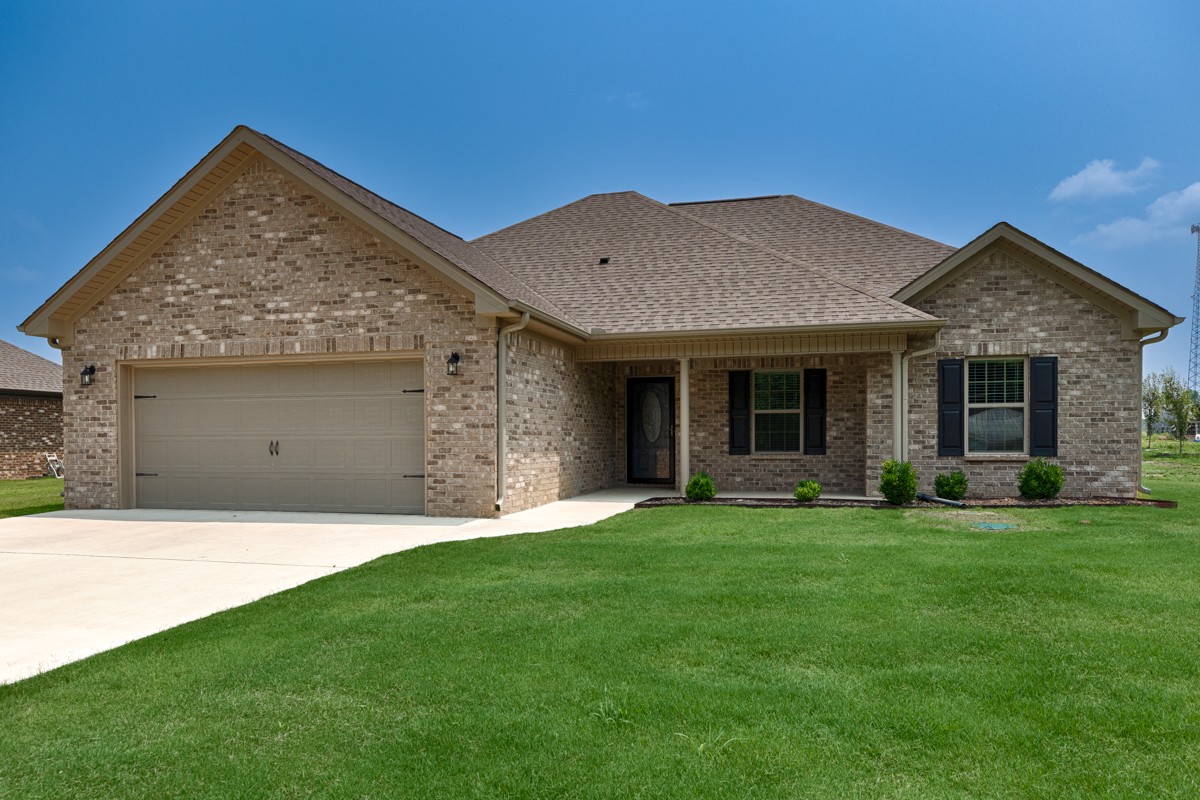 28600 Reyer Road Ardmore, AL 35739 - Photo 16 of 28 a front view of a house with a garden and yard